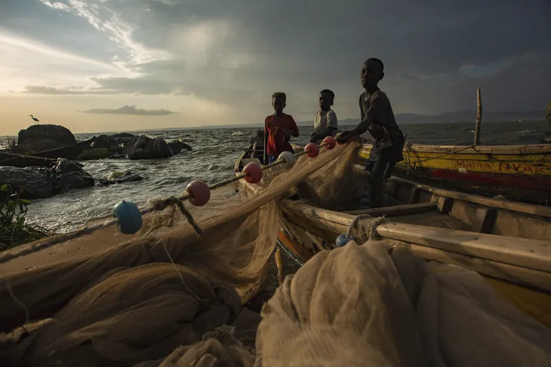Fishermen with their nets at dusk